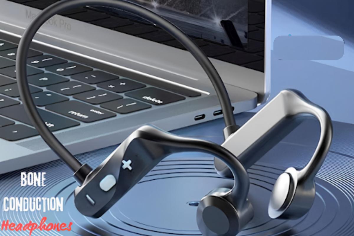 Bone conduction headphones with a black and silver design rest in front of an open laptop keyboard. The words Bone Conduction Headphones appear on the lower left corner of the image.